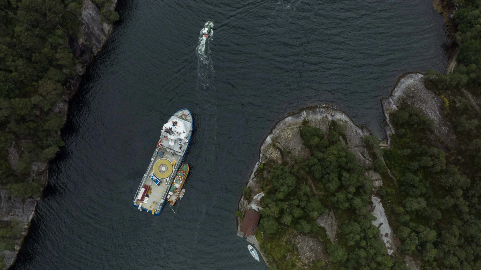 Cable-laying vessel at work in a Norwegian fjord